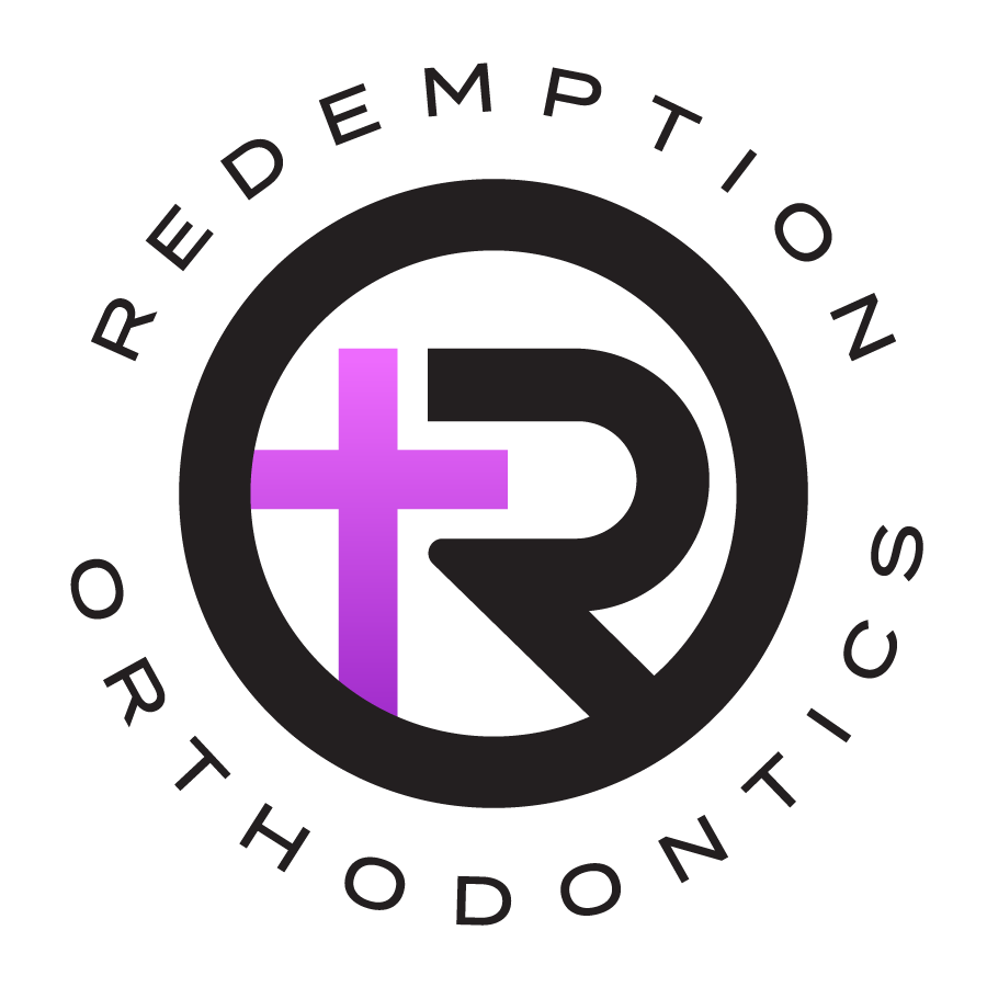 Decorative circular logo for Redemption Orthodontics.